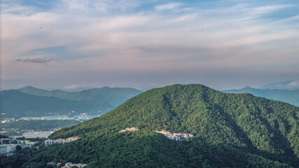 June 8 2025 Scenic View of Lush Green Hills and Distant Mountain Ranges
