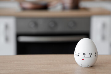 Modern kitchen timer on table in room, closeup