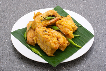 Indonesian street food tahu isi, Fried tofu with spicy vegetables inside and green chili