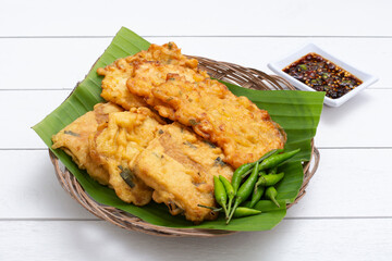 Indonesian food fritters bakwan jagung and fried tempeh with green chili and spicy soy sauce