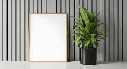 Minimalist Interior Scene: Blank Frame, Lush Plant, and Modern Gray Wall