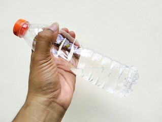 hand holding bottle of water