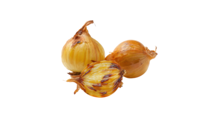 Three whole and halved roasted onions with caramelized layers isolated on transparent background