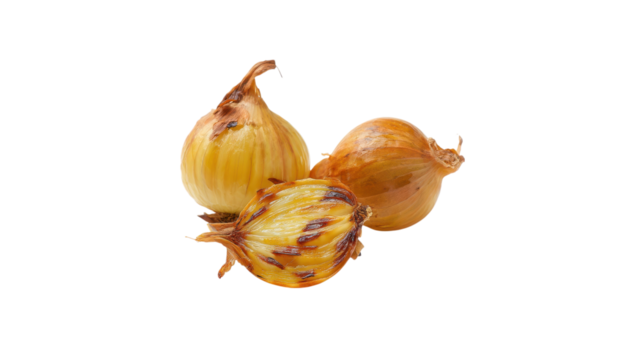 Three whole and halved roasted onions with caramelized layers isolated on transparent background