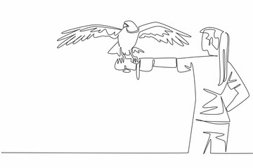 Single one line drawing peregrine falcon perched on hand of woman. The fastest animal in the world while chasing its prey. Strong claws. Woman Holding Bird. Continuous line design graphic illustration
