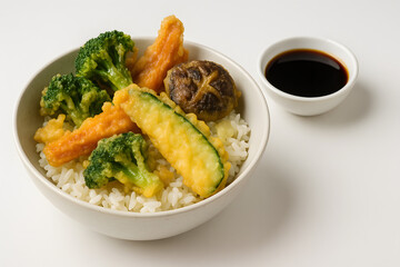 Tempura vegetables on rice with soy dipping bowl