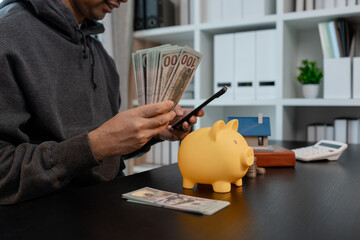 a man uses his savings to buy his dream home, this man plans his finances to buy a home, he uses...