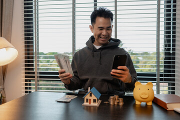 a man uses his savings to buy his dream home, this man plans his finances to buy a home, he uses...