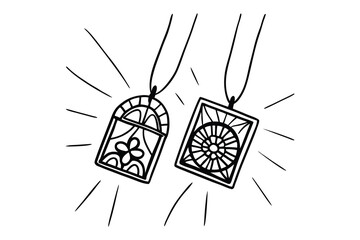 Delicate hand drawn pendants necklaces with intricate design details and radiating lines isolated on white backdrop