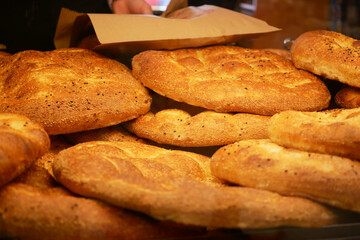 Fresh bread loaves displayed in a bakery window
