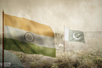 India and Pakistan flags with an inferno landscape background. Pakistan vs India military war conflict. Weapon of a nuclear missile battle