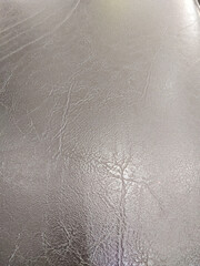 Brown leather texture with natural wrinkles and subtle shine, perfect for upholstery