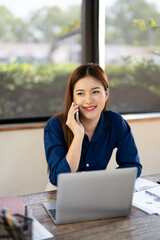 Woman, phone and laptop on talk for remote work with notebook in communication, phone call or...