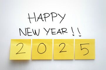 Happy New Year 2025 message with numbers on sticky notes, handwritten in bold, minimalist design on...