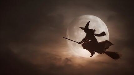 A witch on a broomstick flies in front of the full moon, creating a spooky Halloween image.