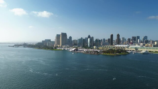 Stunning aerial footage beautifully showcasing the breathtaking skyline of Downtown San Diego, California, featuring vibrant waterfront views and the lively atmosphere of urban city life all around