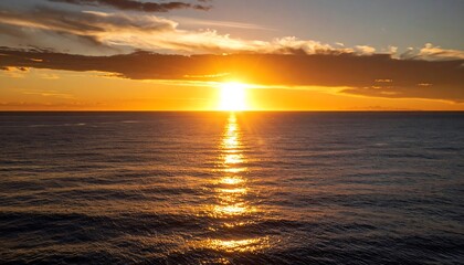 Fototapeta premium Golden sunset over calm ocean