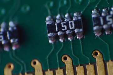 The metallic gold pins and the microstructures of the board, capturing the precision and detail of...