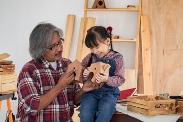 Carpenter family lifestyle activities concept, happy old age grandpa carpentry owner spends time...