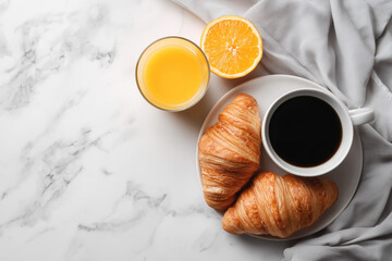 flat lay on white marble, croissants, orange juice, black coffee