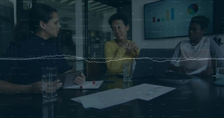 Right colleague shifting chair, listening as central speaker animating charts showing business data
