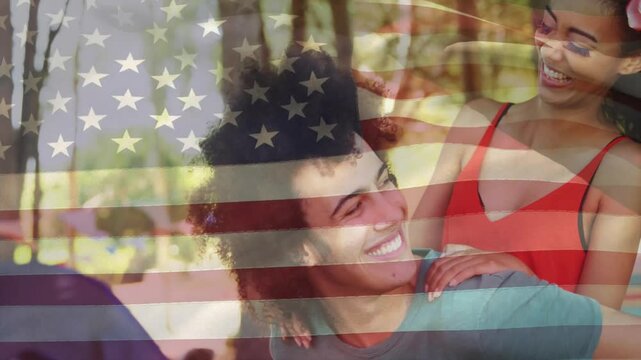 woman leaning pressing face sparking man carrying her in park with marketing US-flag overlay
