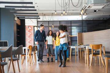Diverse Group of Students and Teacher Walking in Modern Classroom, Teacher Guiding Multi-Ethnic...