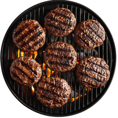 Juicy grilled hamburger patties on a barbecue grill flames visible, overhead view isolated on a transparent background