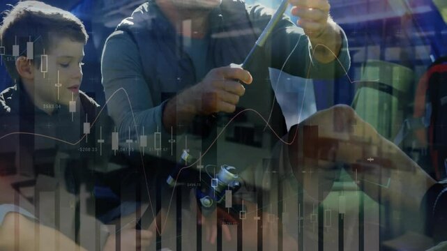 Father unwrapping rod sections guiding son assembling rod on grassy campsite preparing fishing