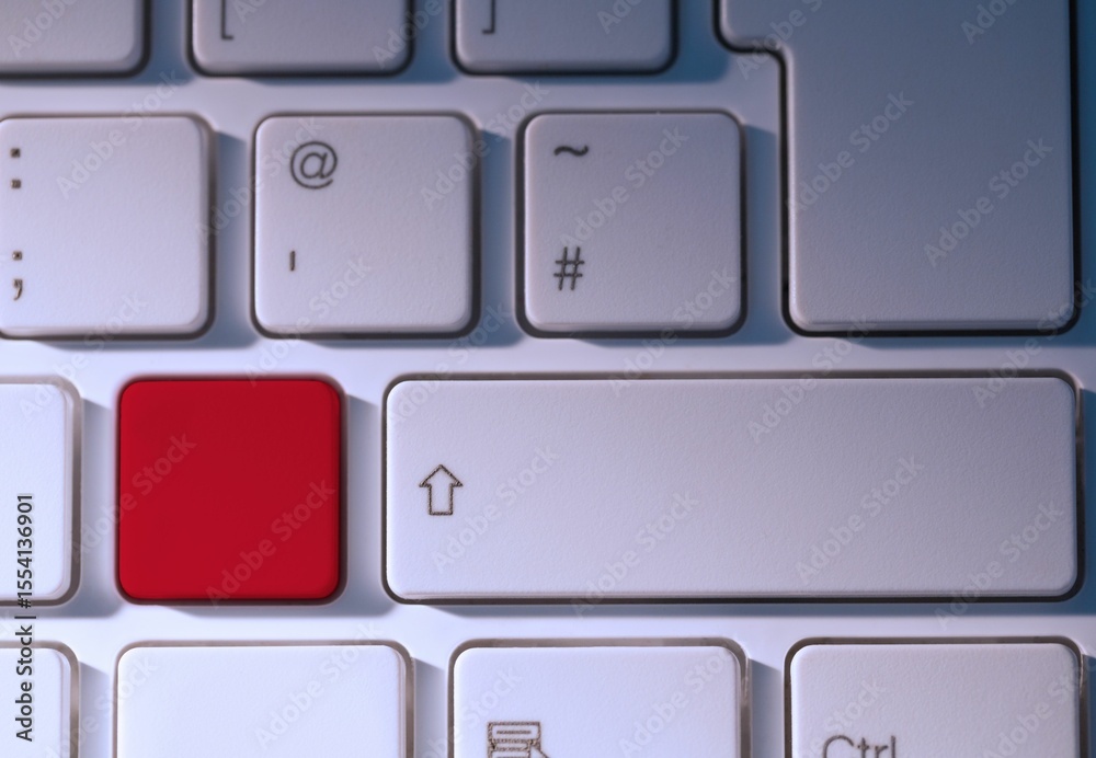 Fototapete digital composite of red key on keyboard