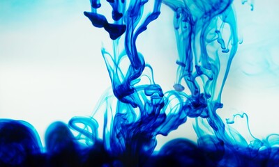 Blue ink spreading in the water