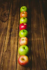 Fototapeten Red and green apples on table © vectorfusionart