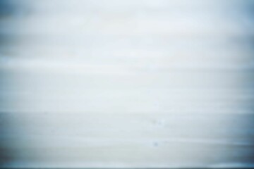 Blurry flat seascape showing calm water meeting pale sky, transparent background, copy space