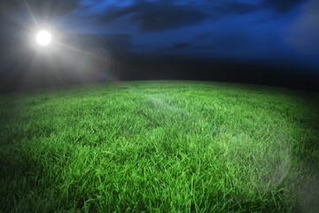 Football pitch under night sky