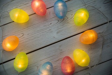 Illuminated lights on wooden planks