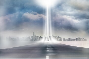 Flat design asphalt road is stretching into foggy city skyline with two vertical light beams