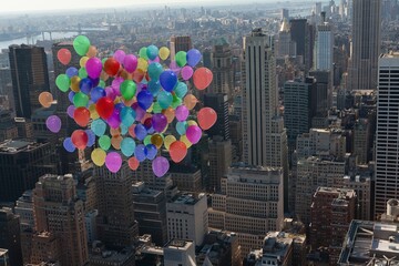 Many colourful balloons above city