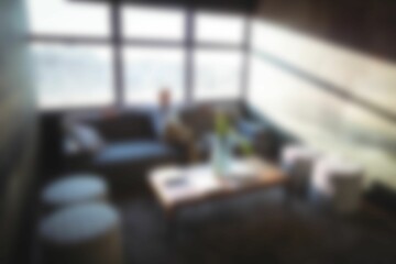 Defocused carefree businessman sitting on sofa
