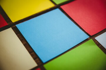 Close-up of square shaped papers