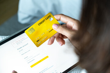 Woman holding several credit cards and he is choosing a credit card to pay and spend Payment for...