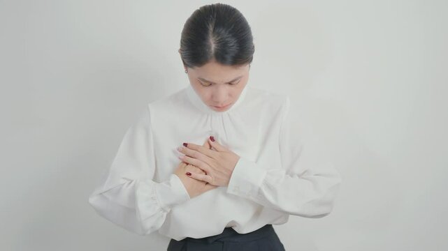Woman having Chest pain for concepts of Lung Disease, Lung Cancer, Asthma, Chronic Obstructive Pulmonary or COPD, Bronchitis, Emphysema, Cystic Fibrosis, Bronchiectasis, Pneumonia and world Lung day