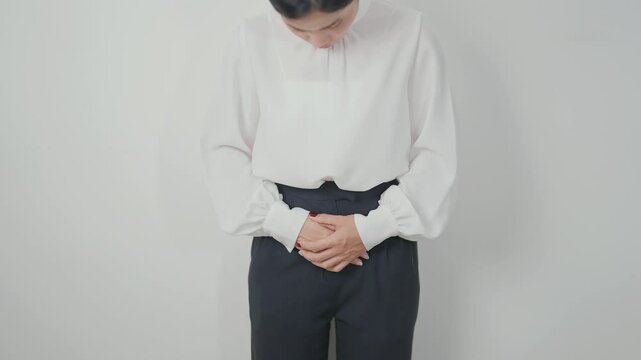 Business woman having Bladder pain for concepts of Bladder disease, Cancer Awareness Month May, Cystitis, Bladder Stone, urinary tract infection, UTI, Urethritis, Pyelonephritis, Urinary incontinence