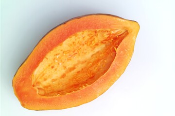 Half of a papaya with its seeds removed, showing the vibrant orange flesh and natural texture of...