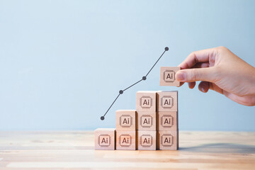 A hand stacking wooden blocks labeled with "AI" icons, forming a staircase graph that symbolizes the rising development and impact of artificial intelligence.