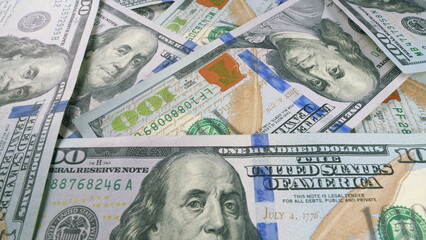 A closeup view of neatly stacked U.S. Dollar Bills, highlighting their financial significance