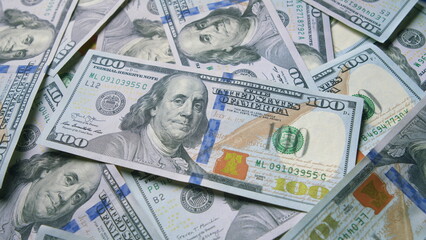 A Stack of U.S. Dollar Bills That Are Neatly Piled Together in an Organized Manner