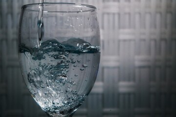 Pouring water into a glass