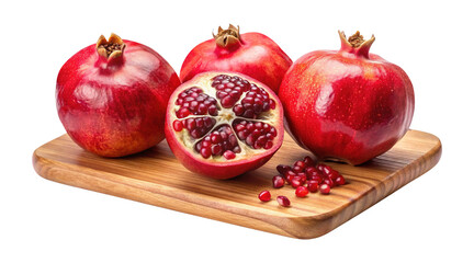 Pomegranates on a wooden cutting board offer a vibrant and healthy treat on Transparent background PNG
