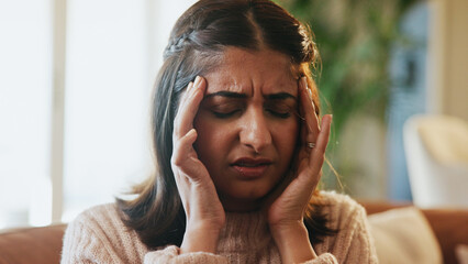 Woman, pain and headache of stress in home for financial crisis, mortgage debt or overwhelmed....