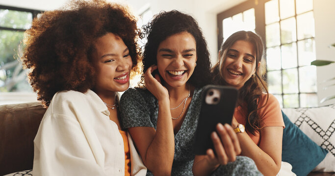 Fototapeta Phone, laughing and relax with friends on sofa for support, bonding and social media together. Post update, smile and connection with women in living room of home for love, reunion and online meme